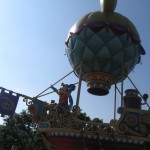 Mickey and his friends on a sailing boat with an air ballon attached