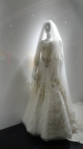 A white mannequin in a beaded wedding dress