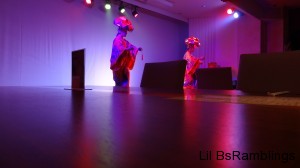 Two lady dancers clicking wooden instruments as they danced.