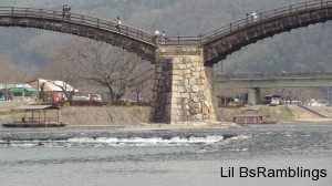 A stone support for the wooden bridge