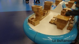 A blue and white table with large wooden blocks.